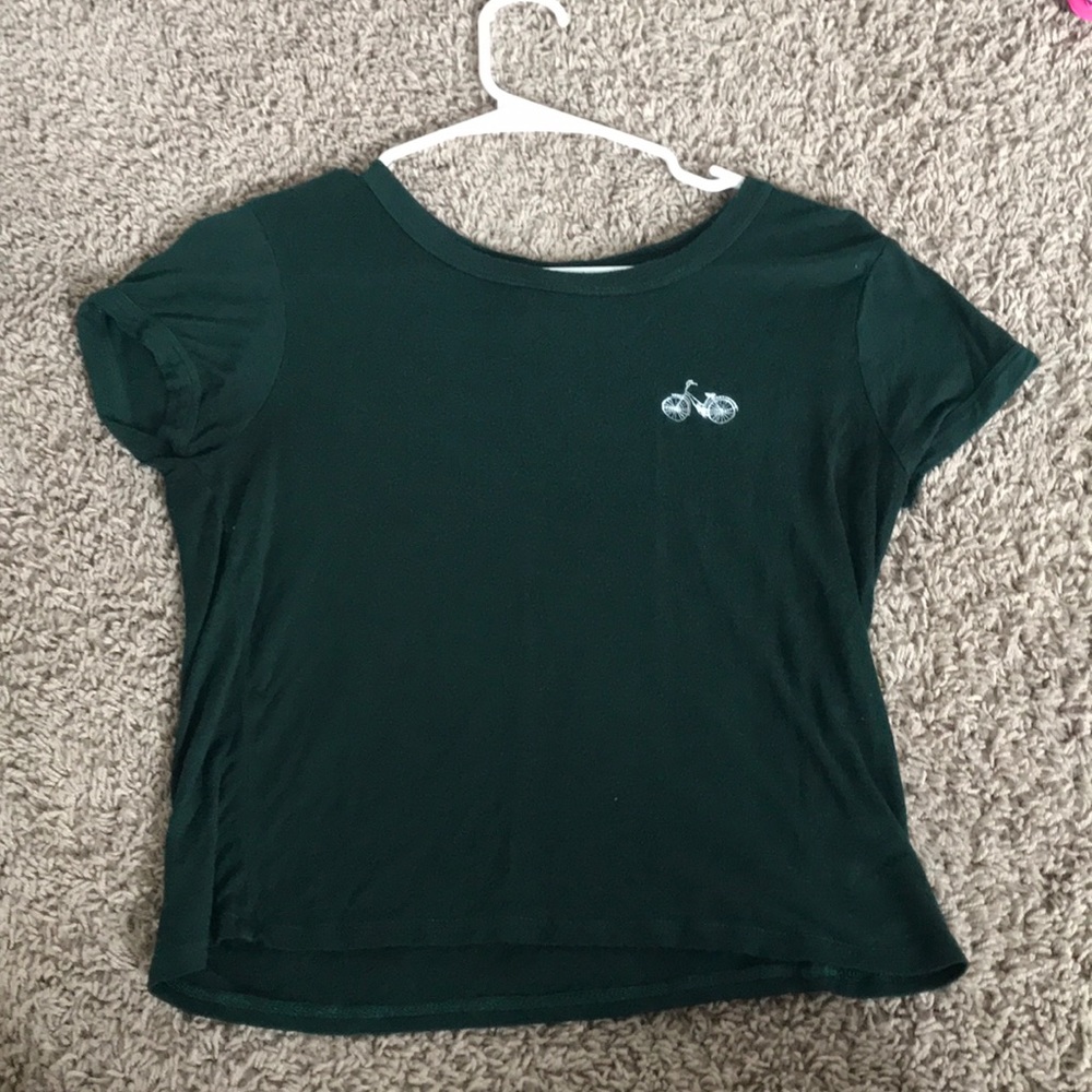 Green shirt with an embroided bicycle